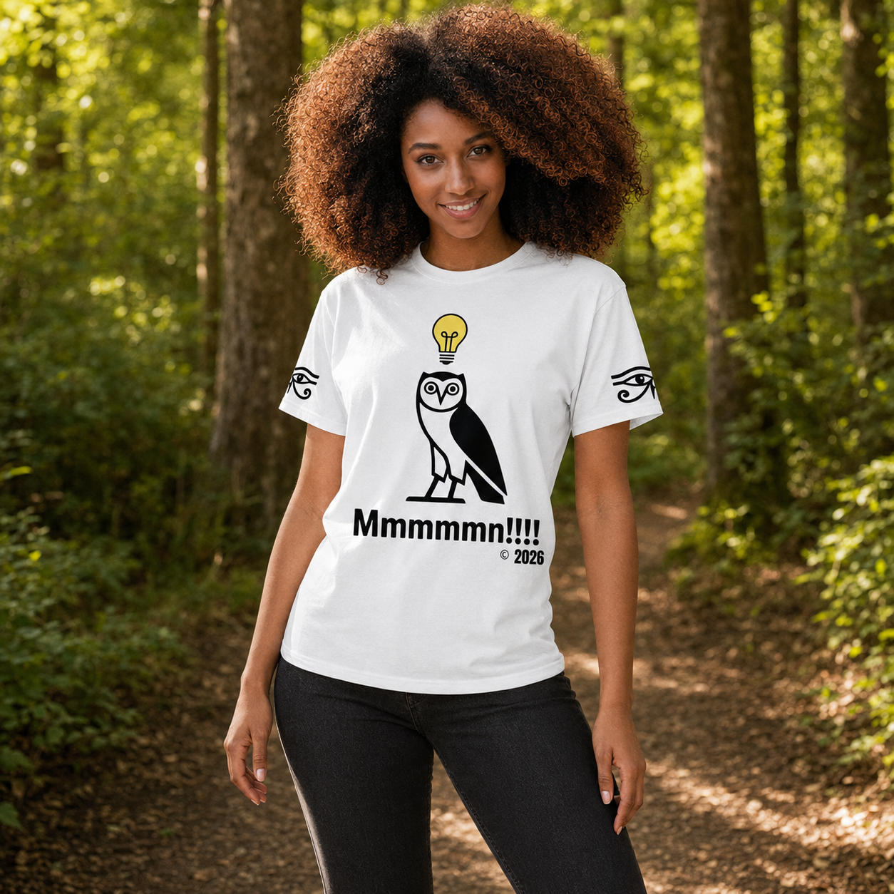 Woman wearing the white MMM Mind T-shirt in sunlit woodland